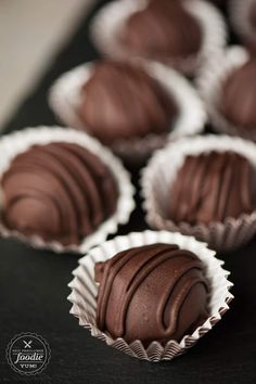 chocolates are lined up on a table ready to be eaten