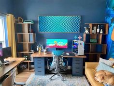 a dog sleeping on top of a couch next to a computer desk