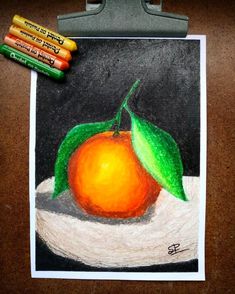 a drawing of an orange on a piece of paper