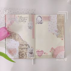 an open scrapbook with pink flowers and teddy bears