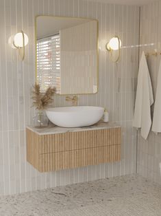 a bathroom with a sink, mirror and towel rack