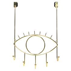 an eye - shaped metal rack with four hooks and two eyes on each side, hanging from the ceiling