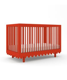 a red crib with white sheets on the bottom and sides, in front of a white background