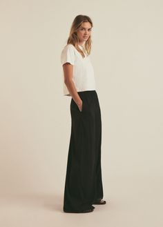 Go with the flow in The Summer Friday Pant. Cut from a viscose-comfort blend Black fabric with easy pull-on styling, an elastic waistband and side pockets in a wide-leg, relaxed fit. Pairs perfectly with The Friday Shirt for chic styling.36% Viscose, 4% Spandex, 60% Lyocell Micro Jersey BlendMegan is 5'10" wearing size S.32.5" Inseam Summer Friday, Friday Shirt, The Friday, Go With The Flow, Summer Fridays, Black Fabric, Capsule Wardrobe, Black Pants, Wide Leg