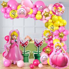 this is an image of a birthday party with balloons and princesses on the table