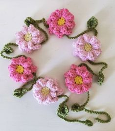 crocheted flowers arranged in the shape of a circle