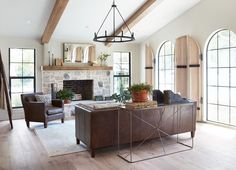 a living room with two couches and a fireplace