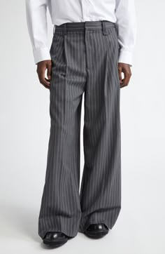 A wide-leg silhouette gives a casual angle to these sharply tailored trousers softened with a hint of wool. 31" inseam; 30" leg opening; 14" front rise; 17" back rise (size Medium) Zip fly with hook-and-bar closure 55% polyester, 43% virgin wool, 2% elastane Dry clean or hand wash, dry flat Made in Portugal Designer Clothing Asian & Pacific Islander Owned/Founded Wide Leg Suit Pants Men, Men Pants Style, Men’s Wide Leg Trouser, Mens Wide Leg Pleated Trousers, Luxury Pinstripe Men's Bottoms, Pinstripe Wide-leg Pants With Pockets, Menswear Casual, Luxury Pinstripe Wide-leg Bottoms, Mens Tailored Suits