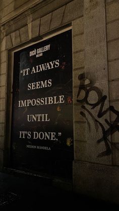 a sign on the side of a building that says it always seems impossible until it's done