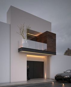 a car parked in front of a white building with plants growing out of the windows