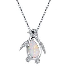 PRICES MAY VARY. Material: Lovely opal penguin pendant necklaces were made of environmental friendly copper, nickel-free, lead-free, cadmium-free and hypoallergenic, harmless to sensitive skin. Fashion Opal Penguin Necklace Size: Penguin: 14.8*19mm, Chain length:16inch+2inch(extender chain). Lightweight and comfortable to whole day wear. The penguin look clumsy and cute, which is the perfect gift for penguin lovers and collectors. Give this pretty pendant necklaces as a unique present to your lo Penguin Jewelry, Penguin Necklace, Diamond Charm Necklace, Fire Opal Necklace, Pretty Pendant, Diamond Charm, Chain Choker Necklace, Christmas Gift Jewelry, Jewelry Choker