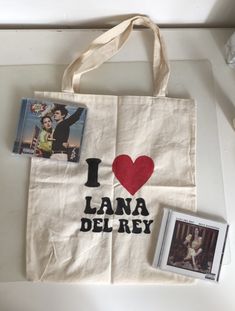 i love lana delray shopping bag with pictures and photos on the front, along with an album