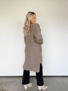 Get bundled up in this cozy knit cardigan, perfect for colder weather. Long enough to keep you warm and stylish all season long! 100% Polyester Hand wash cold. Cozy Taupe Cardigan For Winter, Knit Outerwear For Everyday, Cozy Taupe Winter Cardigan, Fall Cable Knit Beige Sweater Coat, Oversized Cable Knit Sweater Coat For Fall, Oversized Taupe Sweater For Layering, Trendy Beige Sweater Coat For Cold Weather, Oversized Cozy Taupe Sweater, Beige Cable Knit Outerwear For Fall