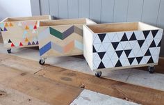 three wooden boxes with geometric designs on them