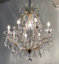 a crystal chandelier hanging from the ceiling