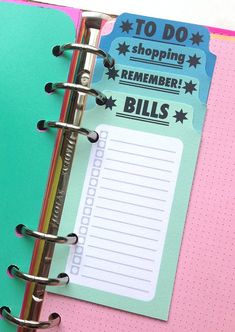 an open planner book with the words to do, shopping, and bill's on it