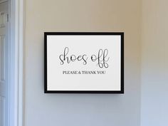 a sign that says shoes off please and thank you hanging on the wall next to a door