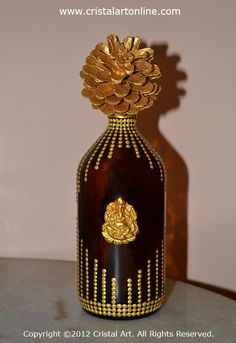 a brown bottle with gold decorations on it