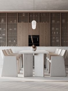 a white table with four chairs and a vase on it in front of a wooden paneled wall