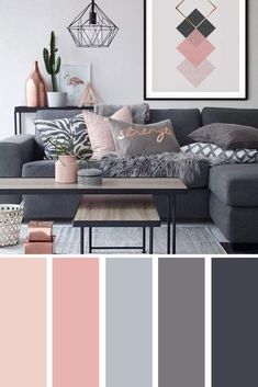 a living room with gray couches, pink and grey decor and pictures on the wall