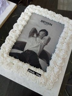 a white cake with an image of a man on it