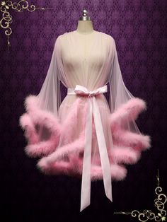 This marabou fur edged boudoir robe is incredibly sexy and playful, perfect for your honeymoon! Photoed in a pink shade, can be made in other colors of your choice. Long： Approx 57-59 inches long Short : Approx 35 inches Long Working Time: 1-2 weeks Rush Order or customization please inquire prior to order. Custom Designs We specialize in custom design services.If there's a dress you like and it's not on our website,you're more than welcome to email us a picture of the dress for a quote. Fluffy Short Hair, Honeymoon Robe, Fancy Robes, Fur Outfit, Bridal Honeymoon, Fur Dress, Wedding Robe, Pink Fur, Pink Lingerie