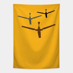 three propeller planes flying in the sky on a yellow background wall hanging from a ceiling