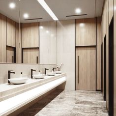 a bathroom with two sinks and mirrors in the wall next to wooden cabinets on both sides