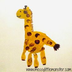 a child's drawing of a giraffe made out of construction paper