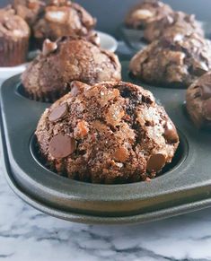 chocolate chip muffins sitting in a cupcake pan