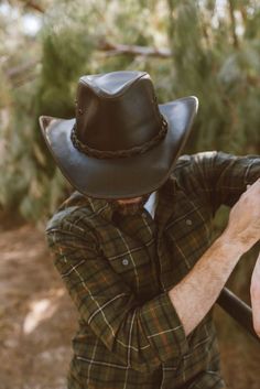 Hollywood | Mens Leather Cowboy Hat The Hollywood mens leather cowboy hat is one of the most popular hats in history. This hat has been worn by some of the most famous people in history and now it can be yours! This cowboy hat is cut and made from genuine leather and stitched with care. Classic Leather Hats For Country Events, Wide Brim Leather Hats For Country Events, Leather Fedora With Curved Brim For Country Events, Leather Wide Brim Fedora For Country Events, Leather Fedora For Country Events, Leather Brimmed Fedora For Country Events, Western Style Hat Bands For Country Events, Leather Riding Hat With Curved Brim, Country Style Hat With Leather Sweatband For Country Events