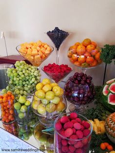 a table topped with lots of different types of fruits and veggies next to each other