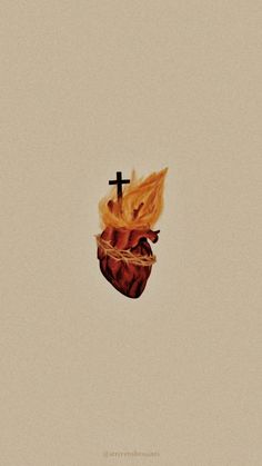 a cross on top of a burning heart