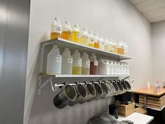 there are many bottles and pans on the shelves