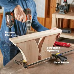 a man working on a piece of wood with two drillers and one screwdriver