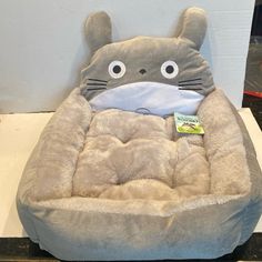 a cat bed that is shaped like a totoro