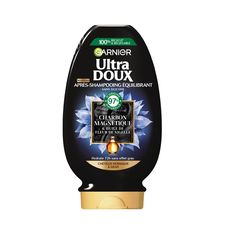 a bottle of ultra douxx on a white background