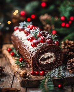 a large piece of cake sitting on top of a wooden table next to christmas decorations