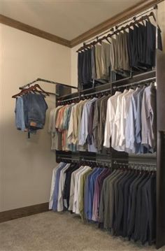 the closet is full of shirts and pants