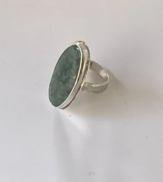 Guatemalan Jade Ring, original design. I created both the ring and the gem, a lovely green natural gemstone from Guatemala, set in sterling silver. 47mm x 20mm cabochon, size 8. Green Polished Sterling Silver Gemstones, Handmade Green Oval Cabochon Ring, Green Sterling Silver Gemstones With Polished Finish, Unique Oval Emerald Ring With Polished Finish, Modern Green Ring With Large Stone, Oval Jade Ring With Natural Stones, Green Rings With Large Oval Cabochon Stone, Modern Oval Jade Ring, Handmade Silver Emerald Ring With Oval Cabochon