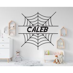 a child's room with a spider web wall decal