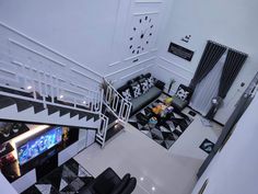 an aerial view of a living room with black and white decor