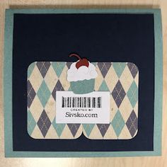 a card with a cupcake on it and a barcode sticker in the middle