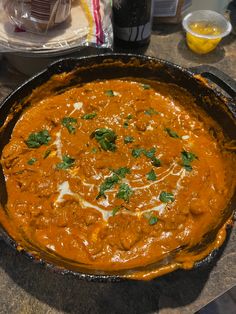 a pan filled with food sitting on top of a counter