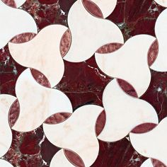 an image of some red and white tiles on the floor with circles in it's center