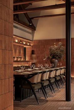 a dining room table set with place settings