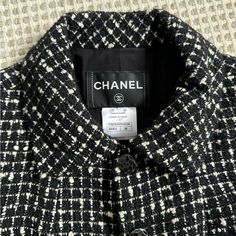 Elegant And Timeless Chanel. Perfect Condition. No Signs Of Wear. Black And White Tweed Boucle Blazer, With Subtly Black Metallic Specs Throughout. Size 36. Fits Xs/S. 2 Subtle Pockets In Front. Black And Silver Monochromatic Buttons Are Also In Perfect Condition. Silk Lining With Monochromatic Flowers. Slight Shoulder Pads. Designer Tweed Outerwear For Business, Designer Tweed Outerwear For Work, Designer Black Tweed Jacket, Designer Black Tweed Jacket With Long Sleeves, Designer Black Tweed Long Sleeve Jacket, Classic White Wool Tweed Jacket, Monochromatic Flowers, Chanel Jackets, Black White Blazer