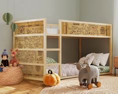 there are two children's bunk beds in this room, one is made out of wood and the other has an elephant toy