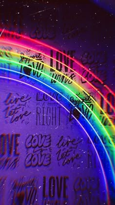 the word love is written in rainbow colors