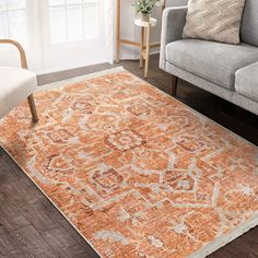 an orange rug in a living room